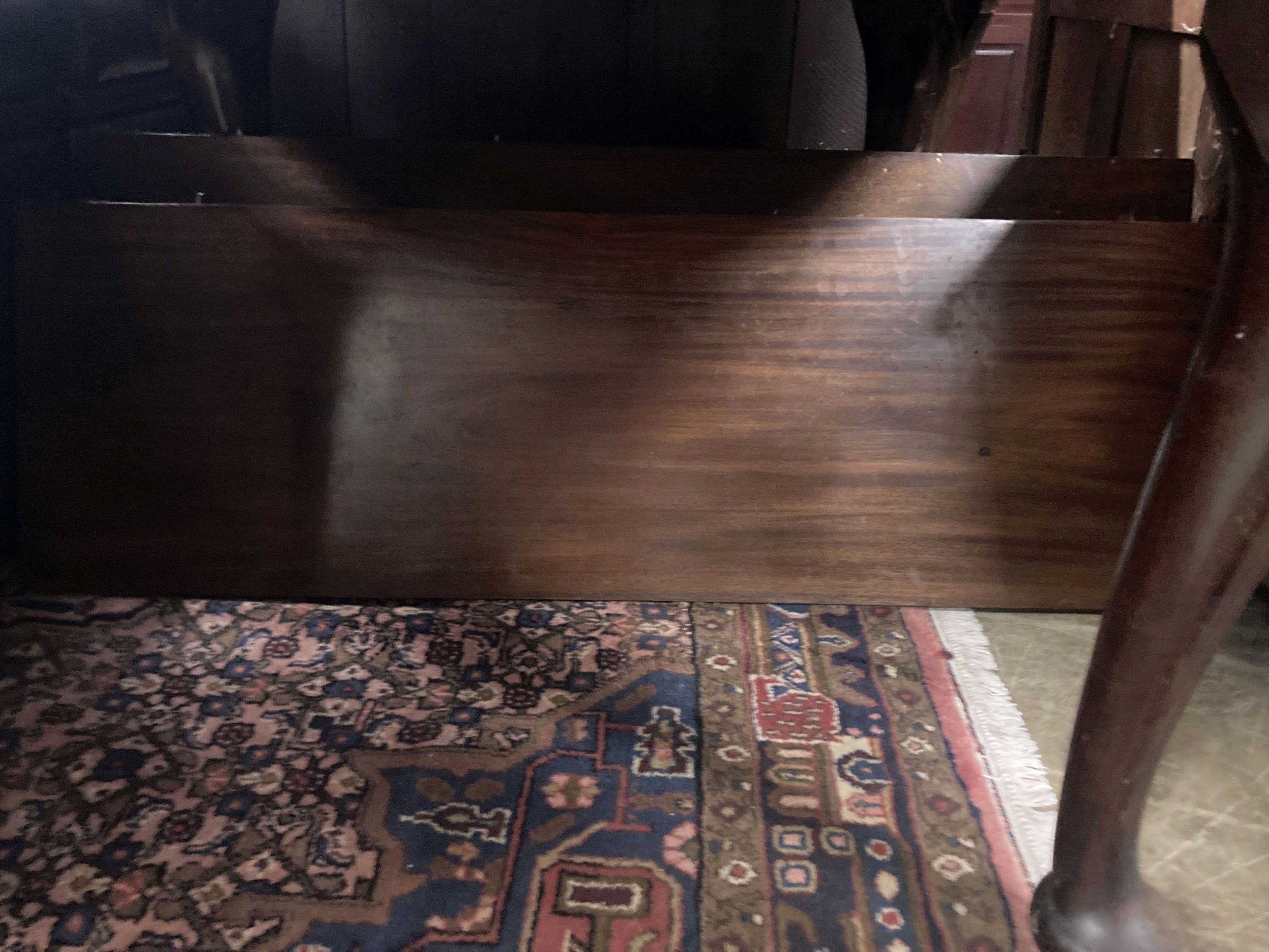 A 1920's circular mahogany extending dining table with three leaves and handle, length approx. 230cm extended, width 120cm, height 75cm